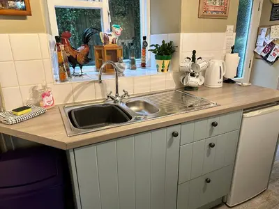 a kitchen counter with a sink and a window at Llanidloes Townhouse-pet-friendly-sleeps 7-Mid Wales in Llanidloes