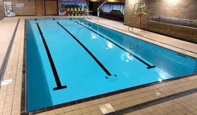 a large swimming pool with blue water at Llanidloes Townhouse-pet-friendly-sleeps 7-Mid Wales in Llanidloes