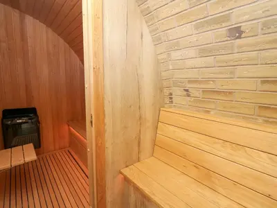 a small sauna with a brick wall and a woodenvisor at Tan Y Wawr - Derwen in Welshpool