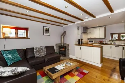 a living room with a couch and a table at The Agents House, Bed & Breakfast in Hay-on-Wye