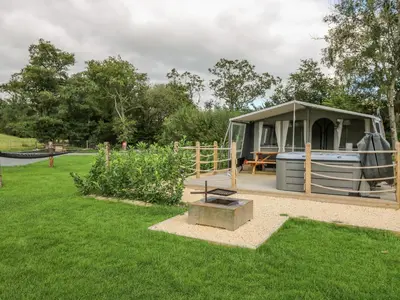 a gazebo in a park with a garden at The Heron in Rhayader