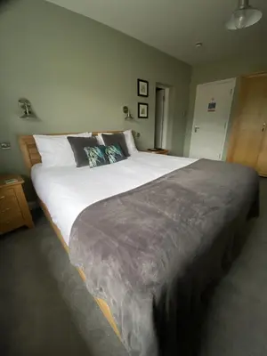 a large bed in a room with a large white bed at Marshpools Bed & Breakfast - Licensed near Weobley village in Weobley