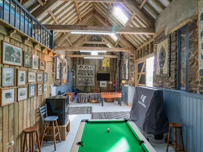 a barn with a pool table in a room at Pen Bont Home Farm in Brecon