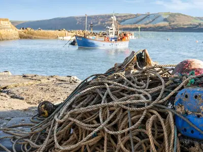 a large pile of rope sitting on the beach at Dau Ddeg in New Quay