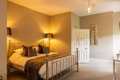 a bedroom with a bed in a room at Marrington Hall in Chirbury