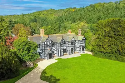 an aerial view of a large black and white house at Marrington Hall in Chirbury