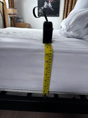 a yellow measuring tape is attached to a bed at Lake view Romantic retreat in Aberystwyth
