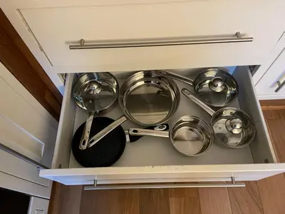 a drawer in a kitchen with pots and pans at Flat 2, Ty Newydd in Barmouth