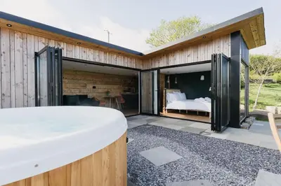 a bedroom in a house with a view of a bed at Dyffryn Ceri in Penuwch