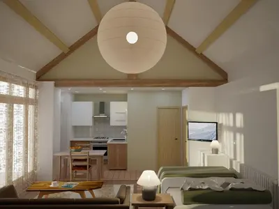 a living room with a table and a ceiling at Y Swdio, Ferm Glandwr in Barmouth