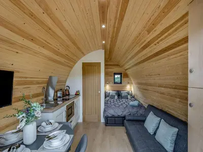 a living room with a large wooden ceiling at Beech Uk36260 in Llanfair Caereinion