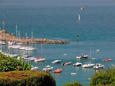 a group of boats are docked in a harbor at Seafield in New Quay