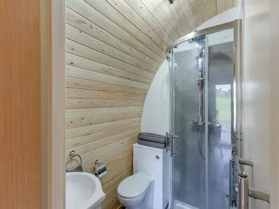a bathroom with a toilet and a shower at Chestnut Uk36261 in Llanfair Caereinion