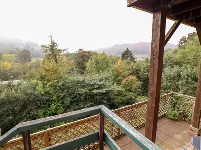 a view from the balcony of a cabin in the mountains at Westoe Hideaway in Llangollen
