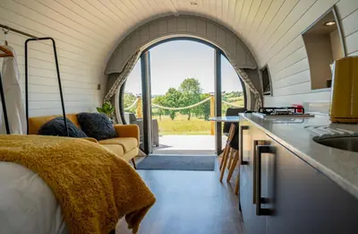 a kitchen and living room in a tiny house at Derwen in Welshpool