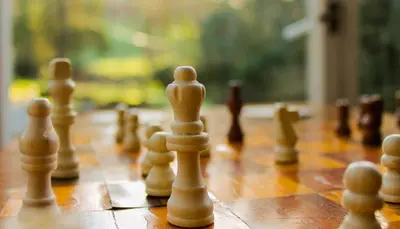 a close up of a chess board with chess pieces at Plas Dolguog in Machynlleth