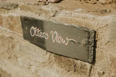 a sign that says after war on a brick wall at Otters View in Rhayader
