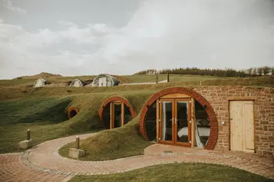 a house shaped like a hill with a door at Otters View in Rhayader