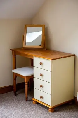 a dressing table with a mirror and a drawer at Pentre Fawr in Llanddewi Ystradenny