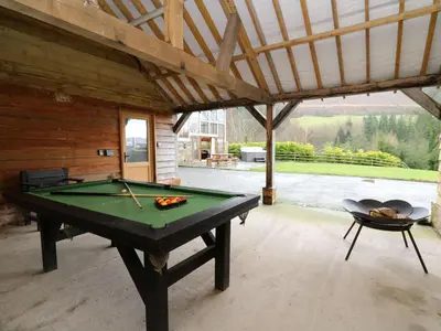 a pool table in the middle of a patio at The Hayloft in Knighton