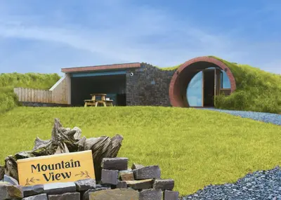 a house on a hill with a sign that reads mountain view at Mountain View in Llanfair Caereinion