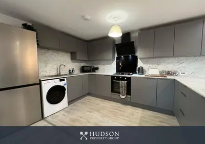 a kitchen with a washer and a dishwasher at Open Plan Townhouse in Shrewsbury in Shrewsbury