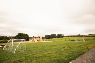 a field with two soccer goals in the grass at Snowdrop in Rhayader