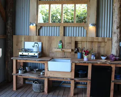 a kitchen with a counter and a sink at The Edwardian Caravan 'Dora' in Lampeter
