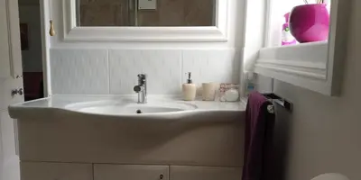 a bathroom with a sink and a mirror at The Stables in Tregaron