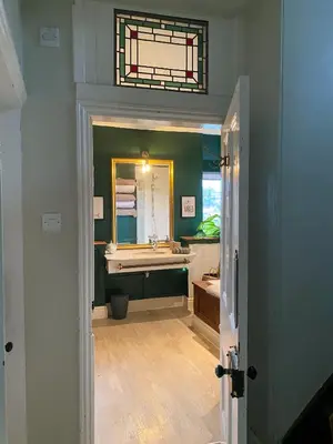 a bathroom with a sink and a mirror at Kennet House in Ludlow