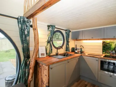 an interior view of a kitchen in a tiny house at Callow Pod in Shrewsbury