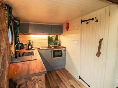 a small kitchen with a sink and a stove at Callow Pod in Shrewsbury