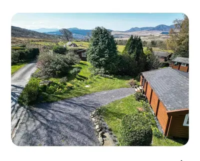 an aerial view of a house and a road at Snowdonia Escapes # TRANQUIL CABIN with Views, Wi-Fi, Dog Friendly & Parking in Trawsfynydd