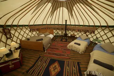 a room with two beds in a yurt at Fred's Yurts at Hay Festival in Hay-on-Wye