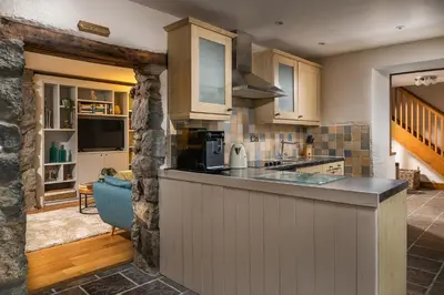 a kitchen with a counter top in a room at Ysgoldy in Llanfor