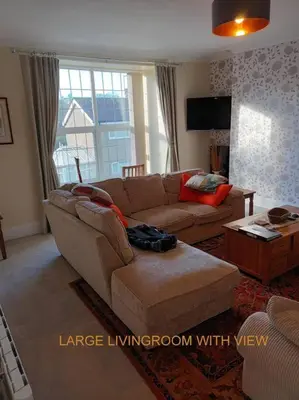 a living room with a large living room with a couch at Harlech/HUGE Three bedroom/BEST location in Llanbedr