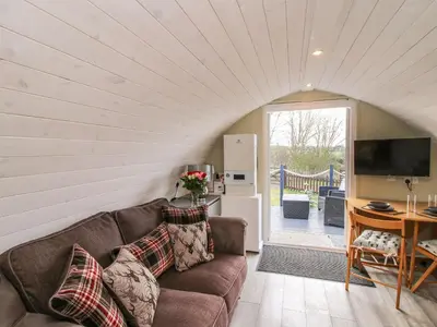 a living room with a couch and a table at Cherry Pod 2 in Shrewsbury