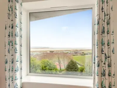 a window with a view of the countryside at Bodwennol - a stunning house! in Aberdyfi