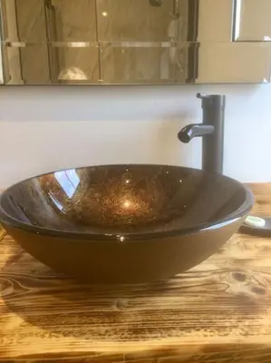 a wooden counter with a sink in a bathroom at HENWICK HOUSE Beautiful flat,Private parking, short walk to town in Ludlow