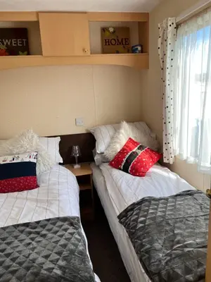 a bedroom with two beds and a window at welcome to B4 in Aberystwyth