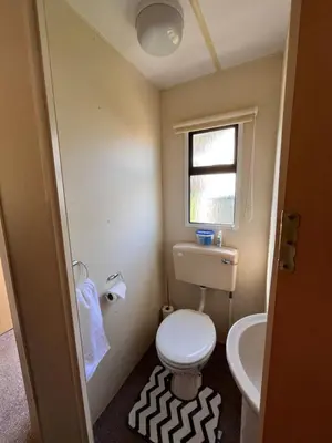 a small bathroom with a toilet and a sink at welcome to B4 in Aberystwyth