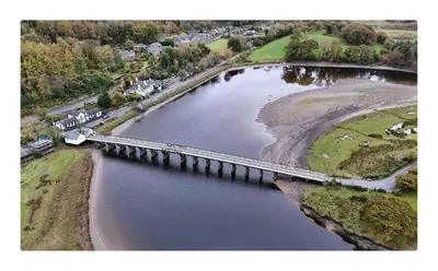 an aerial view of a bridge over a body of water at Robert's Cottage in Abergynolwyn