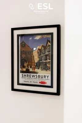 a framed picture of the sherreybury hotel on a wall at 2 Bedroom Terrace Cottage, Parking, 5 minutes drive to Royal Shrewsbury Hospital in Shrewsbury