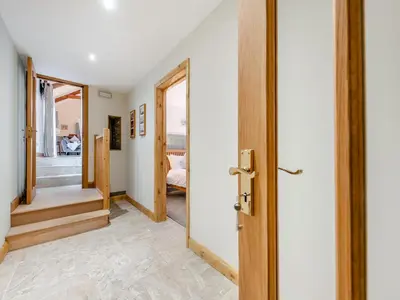 a hallway with a door leading to a bedroom at Bwlchygwynt in Rhandirmwyn