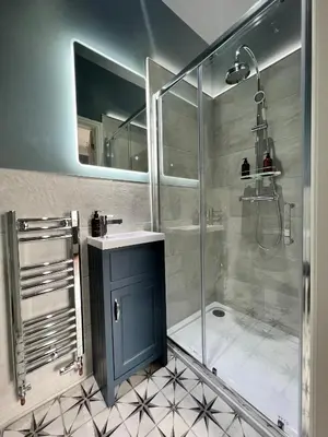 a bathroom with a shower and a sink at Riversdale House Bed & Breakfast in Llangollen