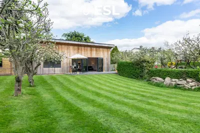 a house with a large lawn in front of it at Quarry View Garden Studio in Shrewsbury with Parking in Shrewsbury