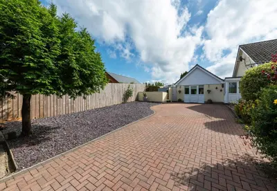 a brick driveway in front of a house at Y Villa Môr in Llanarth
