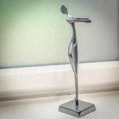 a metal statue of a bird on a stand at St. John’s hill - with parking in Shrewsbury