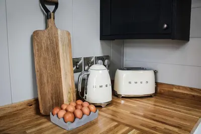 a kitchen counter with a toaster and eggs on it at Buck Barn in Nantmel