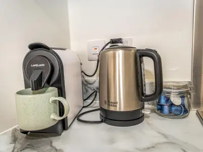 a coffee maker and a toaster on a counter at Brand new 1 bedroom modern contemporary apartment - Pass the Keys in Ludlow